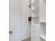 Spacious walk-in closet with ample shelving and drawers at 17607 Gawthrop Dr # 103, Bradenton, FL 34211