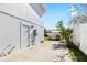 Back patio with concrete slab and utility access at 1790 Ezelle Ave, Largo, FL 33770