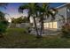 Backyard with patio at dusk at 1790 Ezelle Ave, Largo, FL 33770