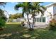 Backyard with patio and tropical landscaping at 1790 Ezelle Ave, Largo, FL 33770