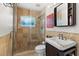 Clean bathroom with beige tile, walk-in shower, and vanity at 1790 Ezelle Ave, Largo, FL 33770