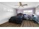 Serene bedroom with dark wood flooring and a unique bed frame at 1790 Ezelle Ave, Largo, FL 33770