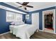 Bright bedroom with ceiling fan and en-suite bathroom access at 1790 Ezelle Ave, Largo, FL 33770
