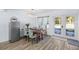 Charming dining area with wood table and french doors leading outside at 1790 Ezelle Ave, Largo, FL 33770
