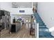 Modern kitchen with stainless steel appliances, granite island, and hardwood floors at 1790 Ezelle Ave, Largo, FL 33770