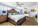 Spacious main bedroom with wood furniture, ceiling fan, and hardwood floors at 1790 Ezelle Ave, Largo, FL 33770