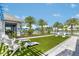 Community lawn with cornhole and lounge chairs at 17920 Palmiste Dr, Bradenton, FL 34202