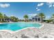 Resort-style pool with lounge chairs and cabanas at 17920 Palmiste Dr, Bradenton, FL 34202
