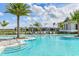 Community pool with shaded seating and a relaxing atmosphere at 17920 Palmiste Dr, Bradenton, FL 34202