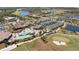 Community overview with pool, clubhouse, and golf course at 18028 Gawthrop Dr # 106, Bradenton, FL 34211