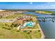 Waterfront community clubhouse, pool, marina, and homes visible at 1810 5Th E St, Palmetto, FL 34221