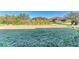 Large backyard with grassy lawn and views of neighboring houses at 1810 5Th E St, Palmetto, FL 34221