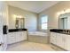 Bathroom with corner soaking tub and double vanity at 1810 5Th E St, Palmetto, FL 34221