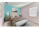 Spacious bedroom with two-toned walls, plush bedding, and ample light at 1810 5Th E St, Palmetto, FL 34221