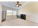 Bedroom with carpeted floors, window, and workspace at 1810 5Th E St, Palmetto, FL 34221