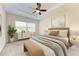 Primary bedroom with neutral decor and ceiling fan at 1810 5Th E St, Palmetto, FL 34221