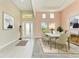Bright dining room with a spacious table and chairs, hardwood floors, and natural light at 1810 5Th E St, Palmetto, FL 34221