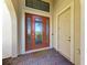 Front entry with double doors and tiled flooring at 1810 5Th E St, Palmetto, FL 34221