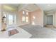 Light and airy entryway with tile floors and access to other rooms at 1810 5Th E St, Palmetto, FL 34221