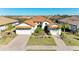 Two-story house with tile roof, two-car garage, and landscaped yard at 1810 5Th E St, Palmetto, FL 34221