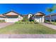 Two-story house with tile roof, two-car garage, and landscaped yard at 1810 5Th E St, Palmetto, FL 34221