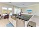Kitchen island with farmhouse sink, stainless steel appliances, and breakfast bar at 1810 5Th E St, Palmetto, FL 34221