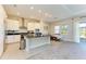 Modern kitchen with white cabinets, granite counters, and island at 1810 5Th E St, Palmetto, FL 34221