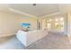 Open concept living room with neutral colored sectional sofa at 1810 5Th E St, Palmetto, FL 34221