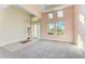 Spacious living room with high ceilings, neutral walls, and carpeted floor at 1810 5Th E St, Palmetto, FL 34221