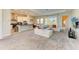 Open living space with kitchen, island and comfortable seating at 1810 5Th E St, Palmetto, FL 34221