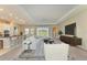 Open concept living room and kitchen with large windows at 1810 5Th E St, Palmetto, FL 34221