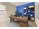 Home office with built-in shelving and modern desk setup at 1810 5Th E St, Palmetto, FL 34221