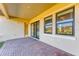 Brick paved patio with sliding glass doors and a view of backyard at 1810 5Th E St, Palmetto, FL 34221
