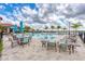 Relaxing pool area with lounge chairs and patio tables at 1810 5Th E St, Palmetto, FL 34221