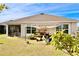 Backyard with covered patio and garden at 2111 Tally Breeze Way, Bradenton, FL 34208
