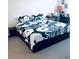 King-size bedroom with patterned bedding and a work station at 2111 Tally Breeze Way, Bradenton, FL 34208