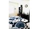 Bedroom with king-size bed, bookshelf, and window at 2111 Tally Breeze Way, Bradenton, FL 34208
