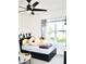 Cozy bedroom with a bed and lots of stuffed animals at 2111 Tally Breeze Way, Bradenton, FL 34208