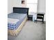 Bedroom with a bed, desk, and chair at 2111 Tally Breeze Way, Bradenton, FL 34208