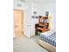 Bedroom with a bed and built-in shelving at 2111 Tally Breeze Way, Bradenton, FL 34208