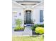 Front entrance with door, plants and walkway at 2111 Tally Breeze Way, Bradenton, FL 34208