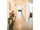 Long hallway with tile floors and access to rooms at 2111 Tally Breeze Way, Bradenton, FL 34208