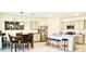 Kitchen with island, stainless steel appliances, and dining area at 2111 Tally Breeze Way, Bradenton, FL 34208