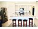 Island kitchen with stainless steel appliances and granite countertops at 2111 Tally Breeze Way, Bradenton, FL 34208