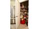 Well-stocked pantry with ample shelving for storage at 2111 Tally Breeze Way, Bradenton, FL 34208