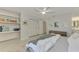 Bedroom with built-in shelves, dresser, and a comfortable bed at 2708 Bigelow Dr, Sarasota, FL 34239