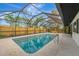 Enclosed rectangular pool with a patio and seating area at 2708 Bigelow Dr, Sarasota, FL 34239