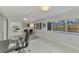 Sunlit home office with pool view and built-in shelving at 2708 Bigelow Dr, Sarasota, FL 34239