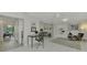 Bright home office with built-in shelving and view of living area at 2708 Bigelow Dr, Sarasota, FL 34239