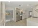 Bright kitchen featuring stainless steel appliances and white cabinetry at 2708 Bigelow Dr, Sarasota, FL 34239